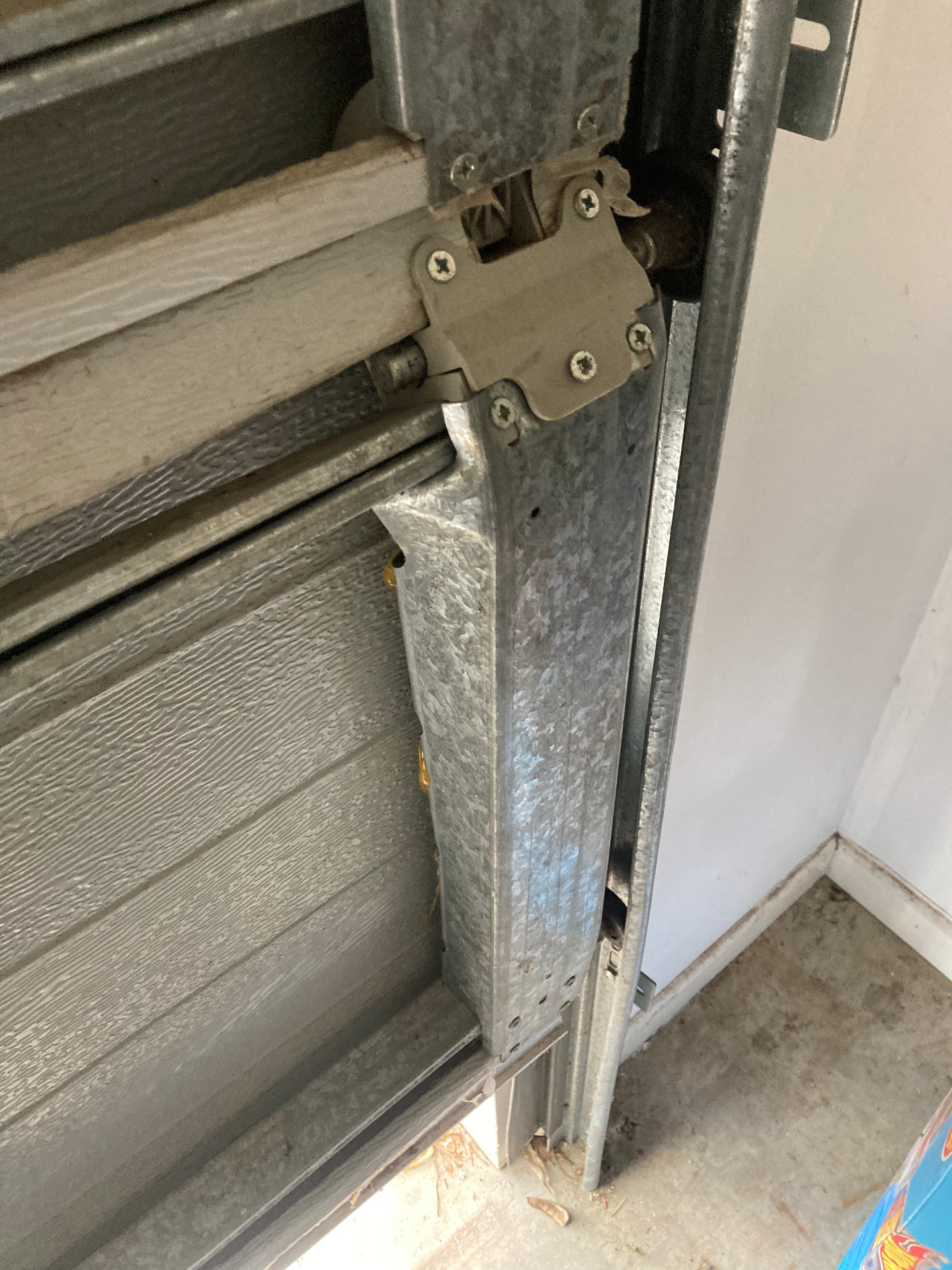 Bent galvanised track bracket on a Centurion sectional door