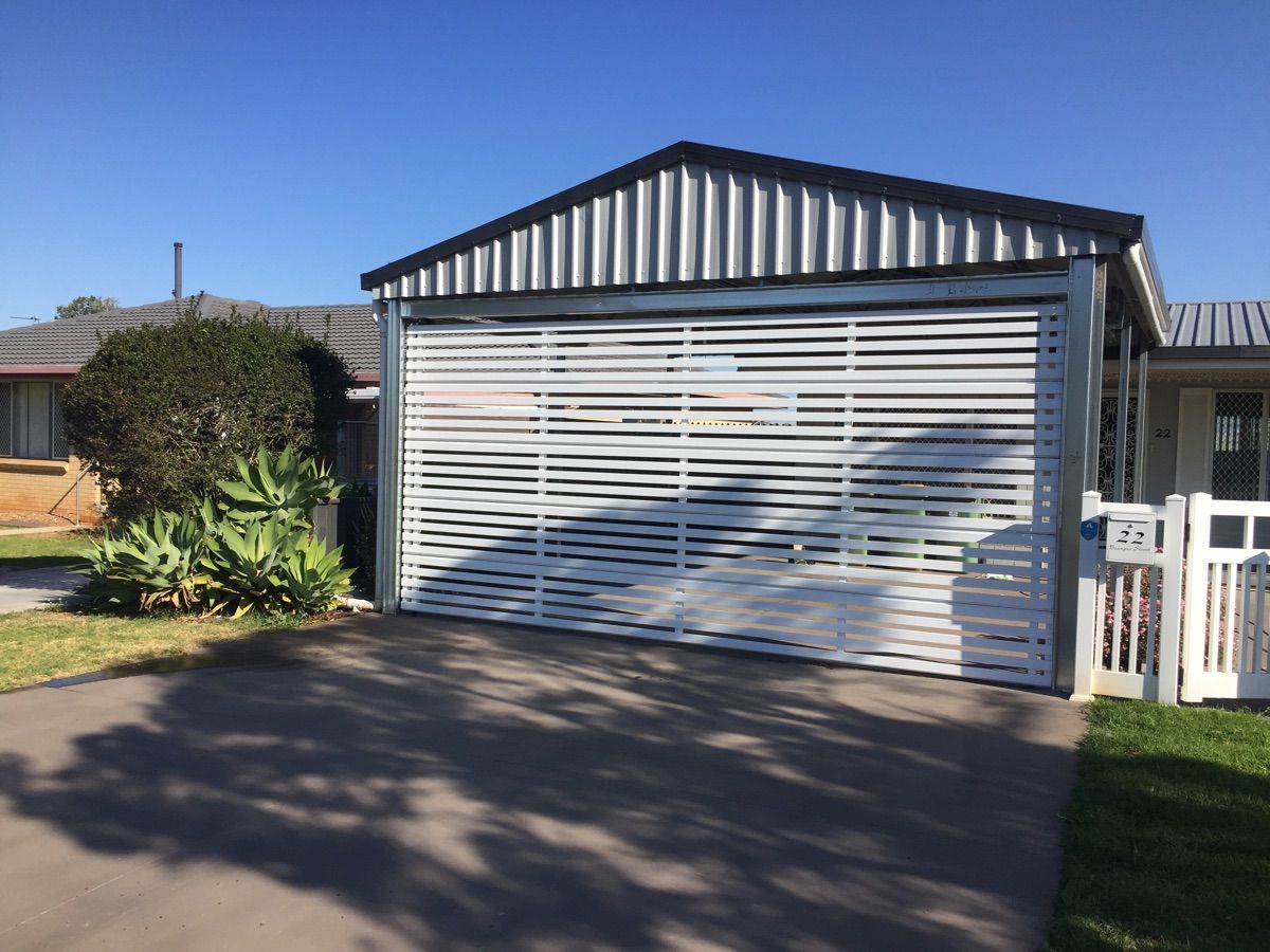 Insulated sectional garage door on a Granite Belt home